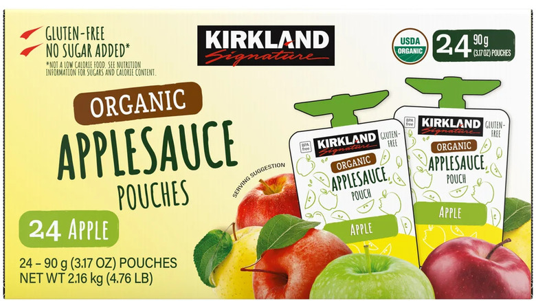 Apple sauce pouches on white background
