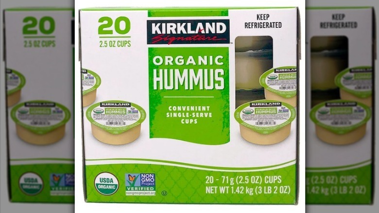 Hummus single serve cups on white background