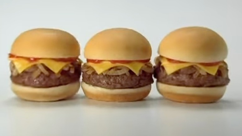 A trio of Jack in the Box Mini Sirloin Burgers against a white background