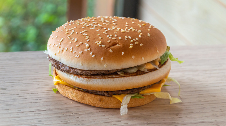 A McDonald's Grand Mac on a wooden table