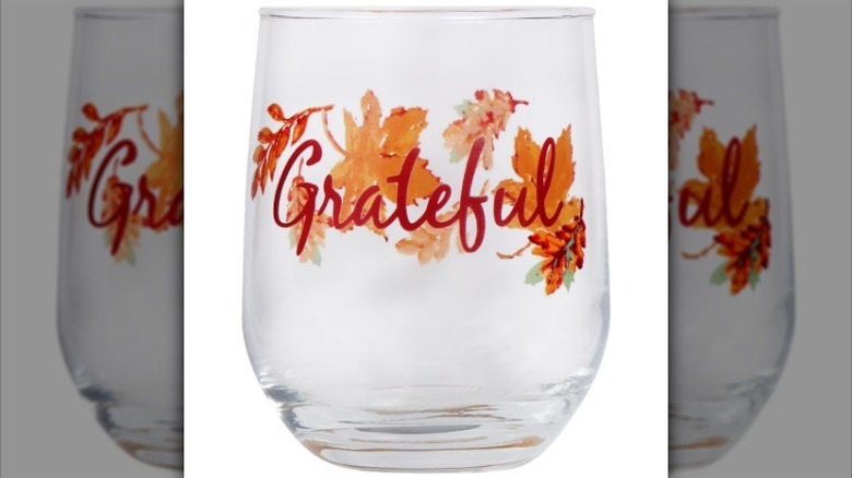 Grateful wine glass on white background