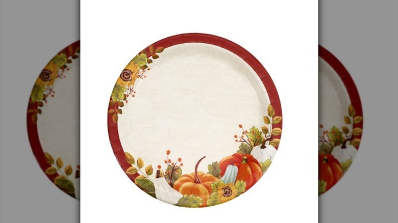 Pumpkin design paper plate on white background