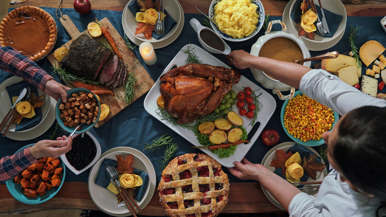 Overview of Thanksgiving dinner with a turkey and side dishes