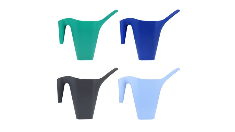 Four colorful watering cans