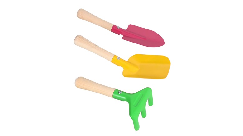 A colorful spade, shovel, and rake