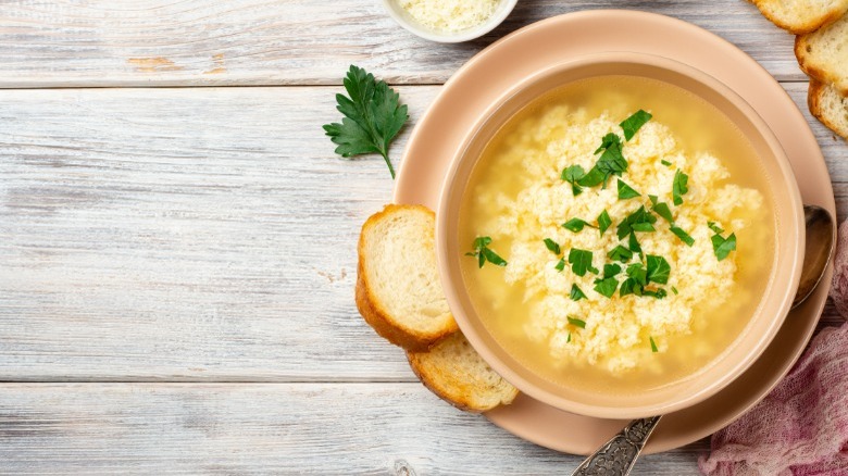 Egg drop soup with bread on side