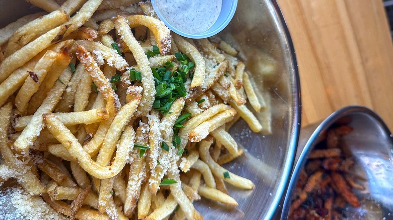 Hopdoddy Burger Bar metal bowls with fries and sauces
