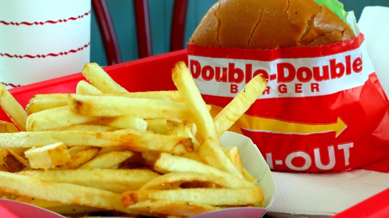 In-N-Out fries, with a Double-Double Burger in the background