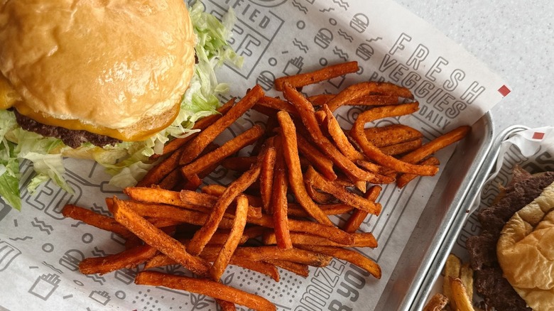 Mooyah burger with fries in metal tray