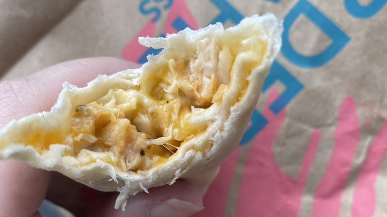 hand holding cheesy melt