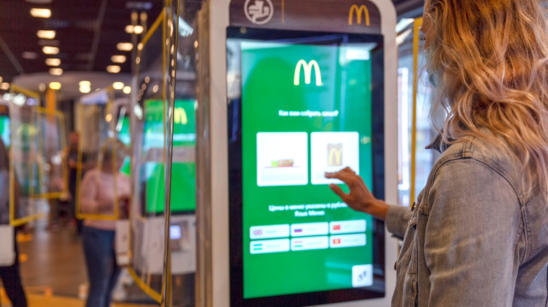 woman ordering on McDonald's screen