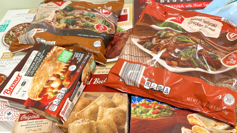 Assortment of Aldi frozen meals piled together