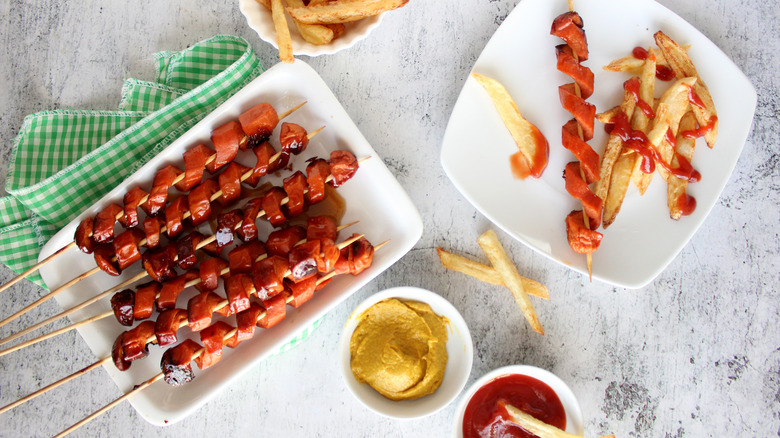 skewered spiral cut hot dogs on plates