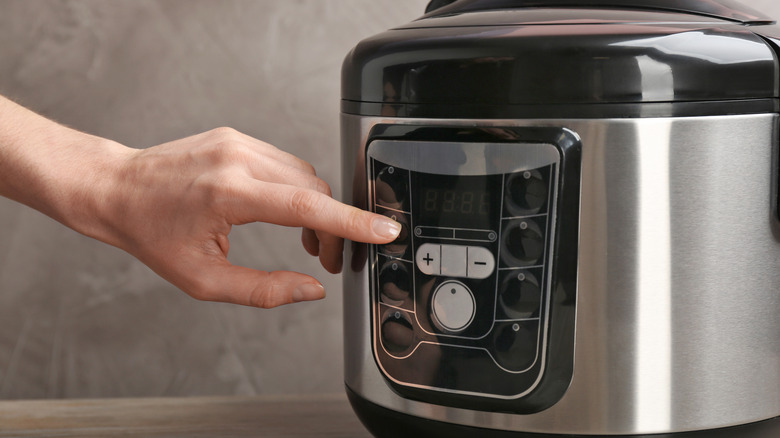 slow cooker with hand