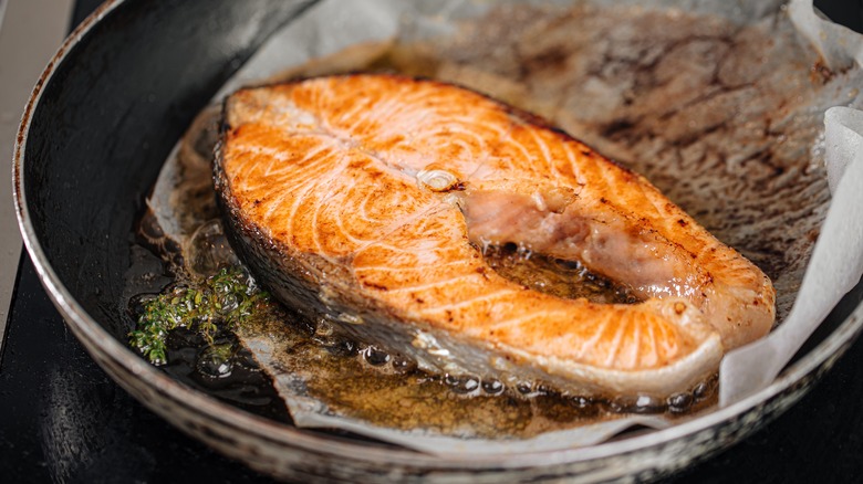 salmon steak on parchment paper