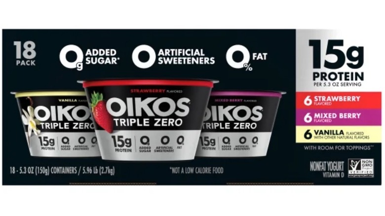 Box of Oikos yogurt cups on white background