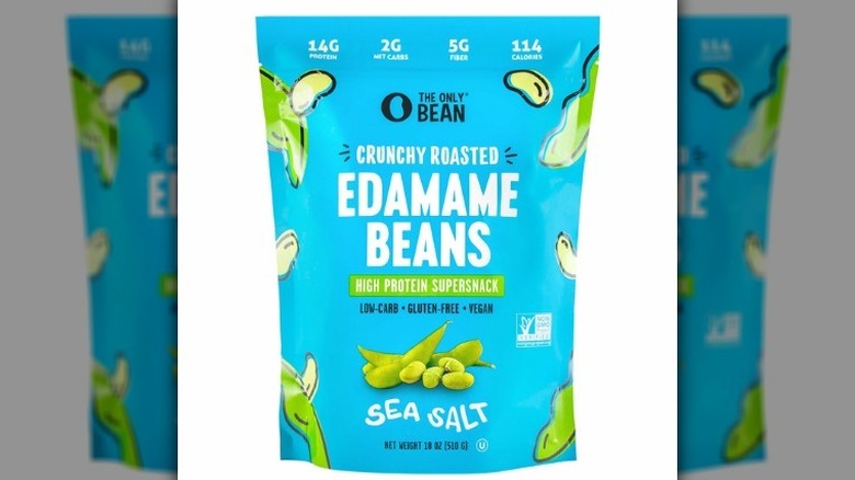 Bag of crunchy roasted edamame on white background