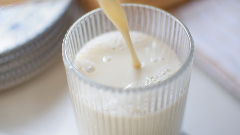 A glass of milk placed on a table