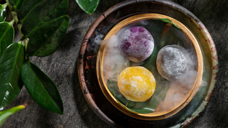 Three mochi desserts on plate