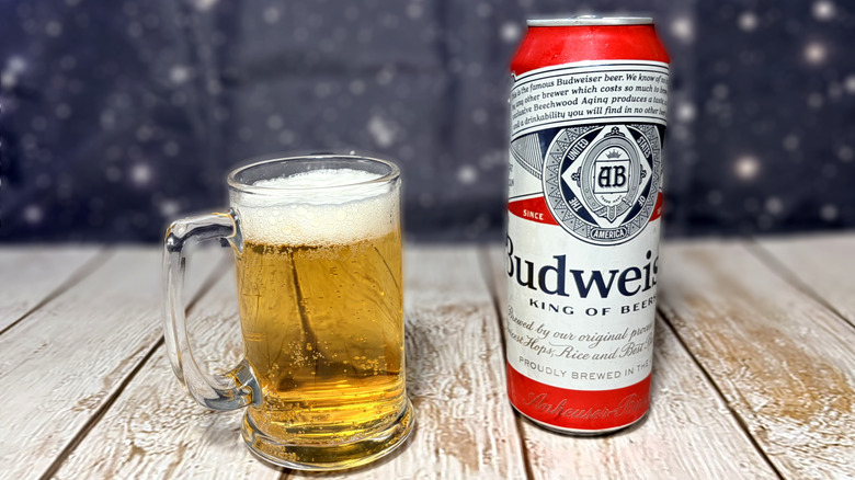 glass and can of Budweiser beer