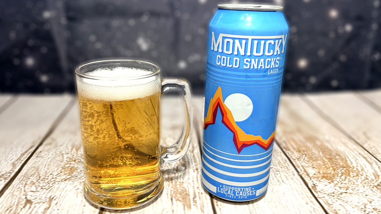 glass and can of Montucky beer