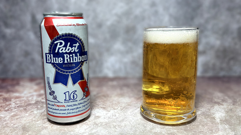 glass and can of Pabst Blue Ribbon beer