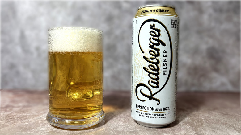 glass and can of Radeberger beer