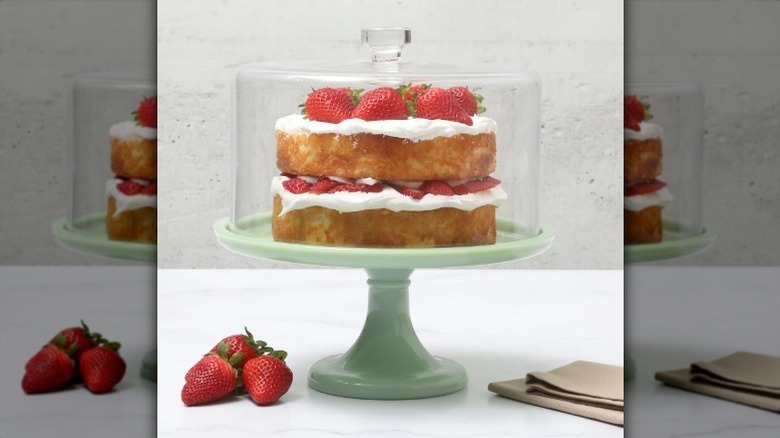 Cake on green cake stand with lid