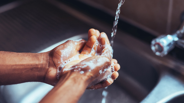 person washing hands