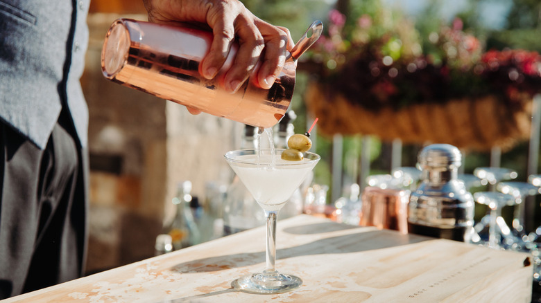 Bartender pouring a martini