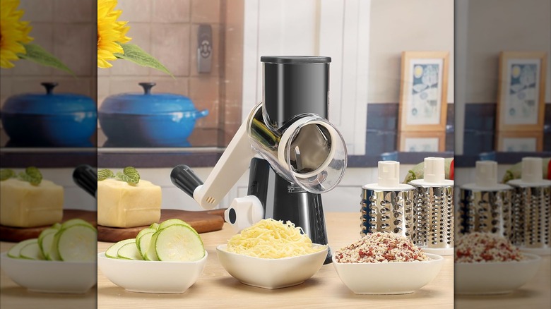 Product image of the Cambom Rotary Grater and Slicer with bowls of sliced, shredded, and chopped items.