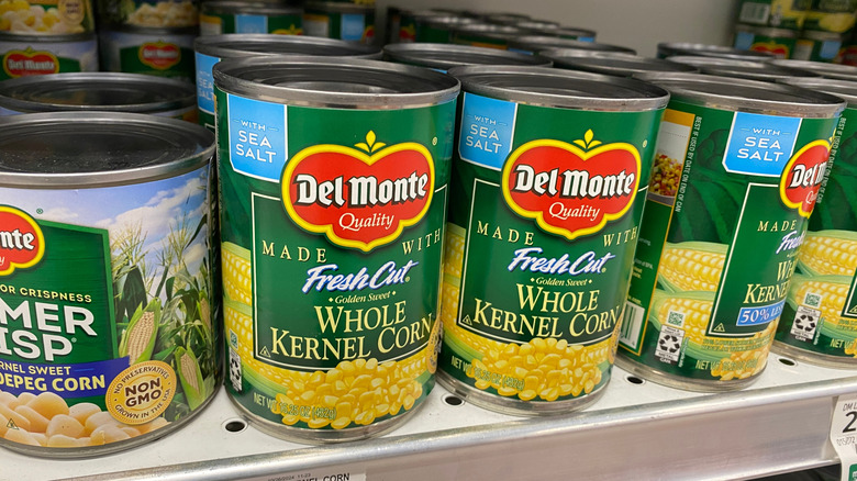 Cans of Del Monte corn