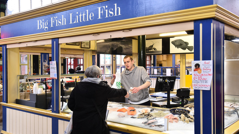 fishmonger selling fish
