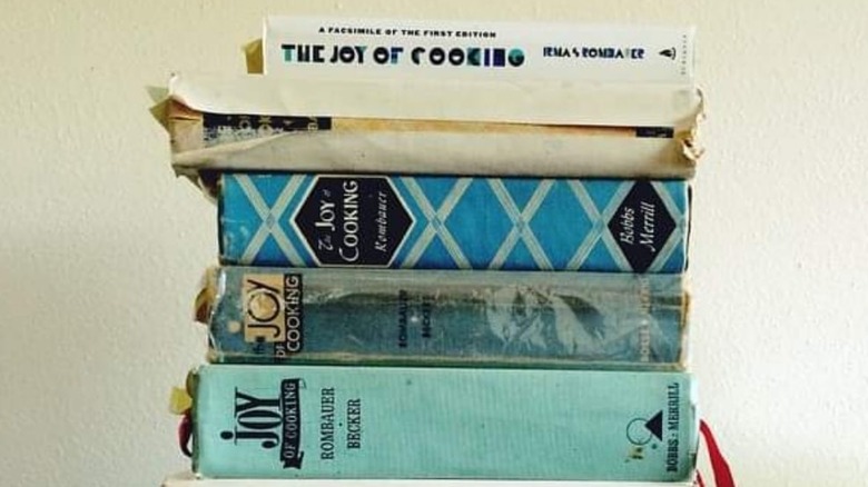 Stack of various Joy of Cooking editions
