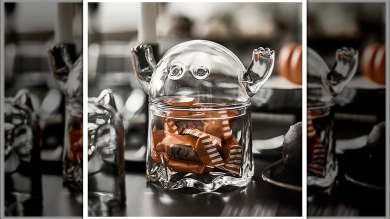 Clear ghost-shaped bowl full of candy