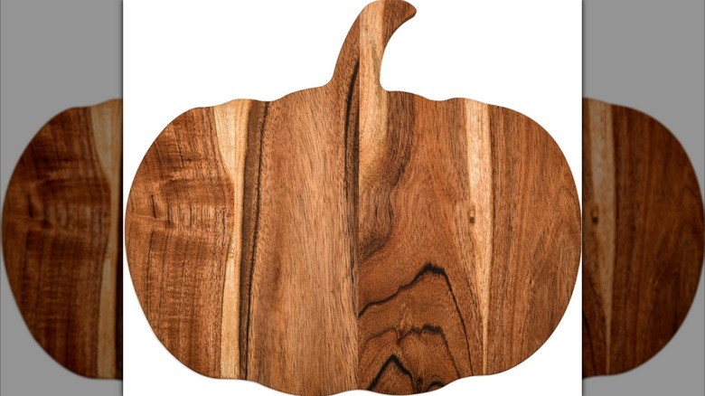 Pumpkin shaped cutting board on white