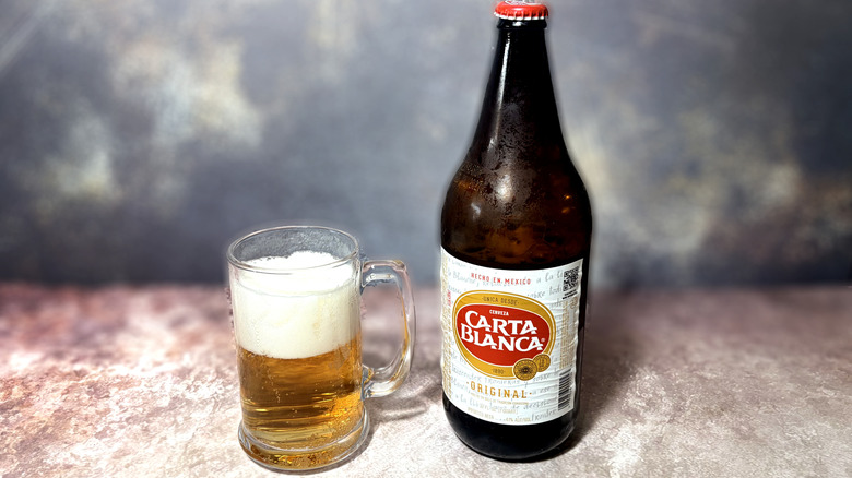 Glass and bottle of Carta Blanca beer