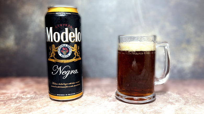 Glass and can of Modelo Negra