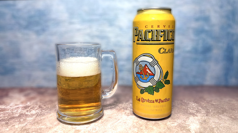 Glass and can of Pacifico Clara beer