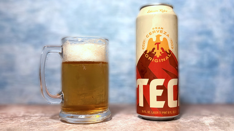 Glass and can of Tecate beer
