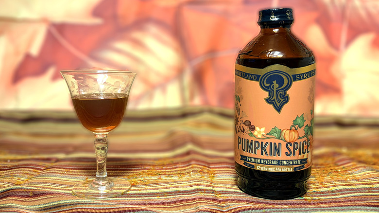 Glass and bottle of Portland Syrups pumpkin spice syrup