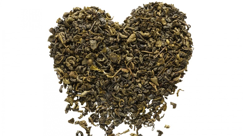 Heart-shaped tea leaves falling
