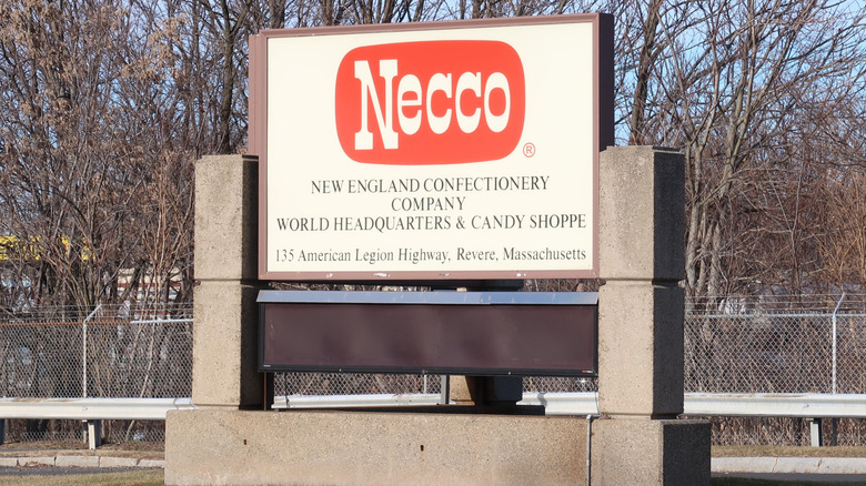 Sign for New England Confectionary Company with the Necco logo.