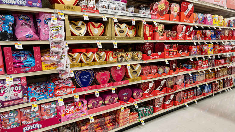 Valentine's Day candy display on grocery store shelves.