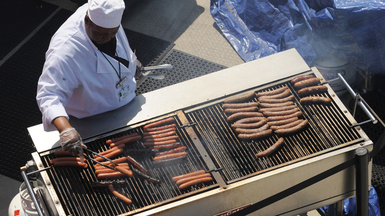 Cooking hot dogs on grill