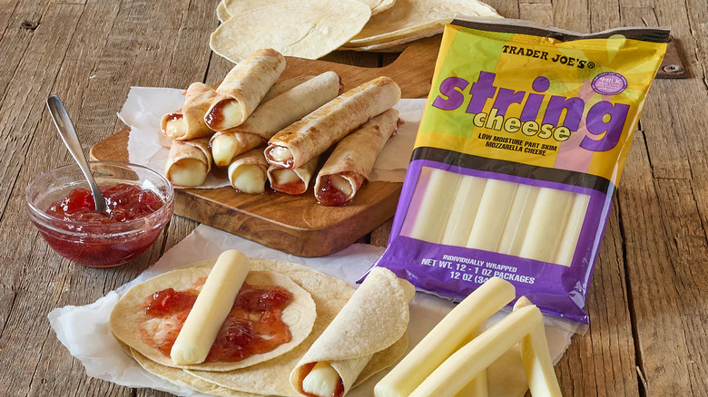 String cheese in package surrounded by string cheese roll ups with tortillas and jam