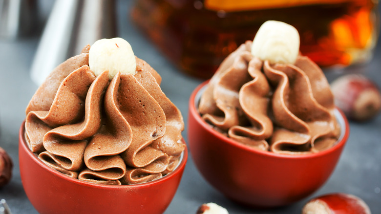 Mousse cupcakes with nut garnish