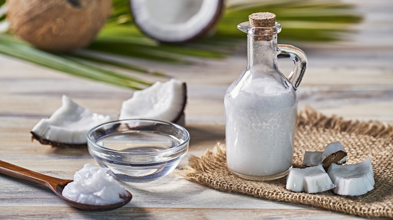 coconut oil and halved coconuts