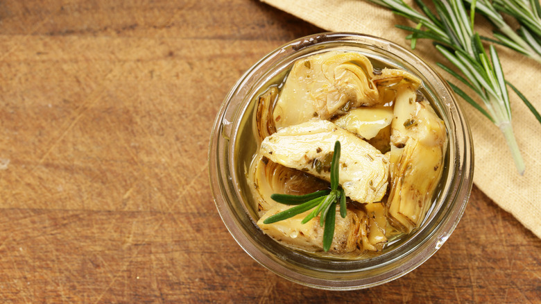 can of artichoke hearts on table