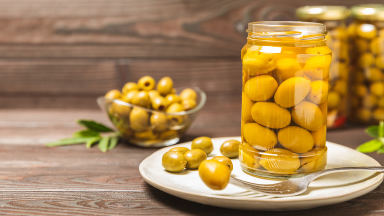 can of olives on table